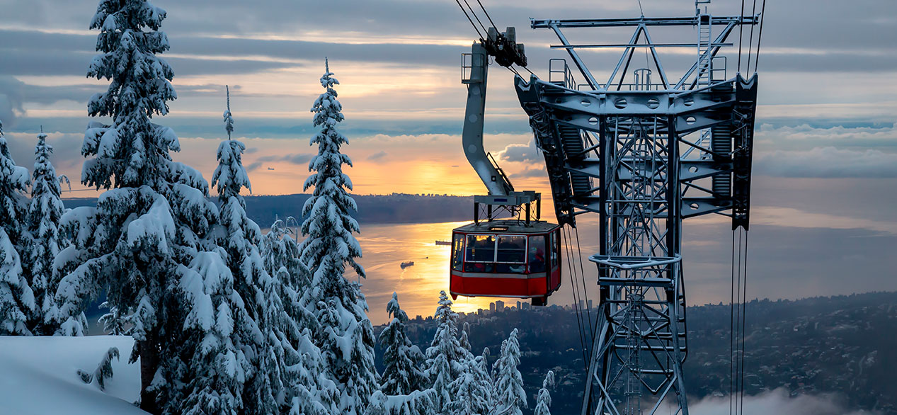 Beautiful view of a Gondola during a vibrant winter sunset. Taken in Grouse Mountain, North Vancouver